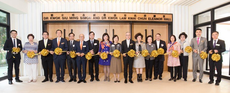 Ribbon-cutting ceremony by the officiating guests. 