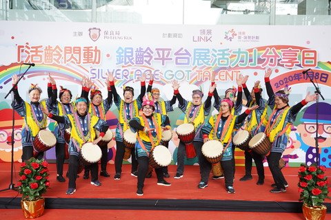 Elderly participants sharing the fruits of the performing arts training on the stage.