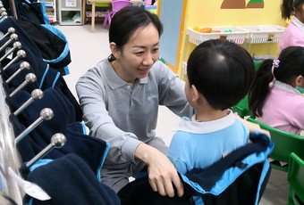 The General Attendants of the Po Leung Kuk Kindergarten-cum-Nursery - Auntie Fan and Auntie Kwan